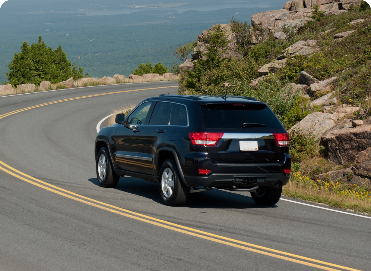 Black SUV on winding road