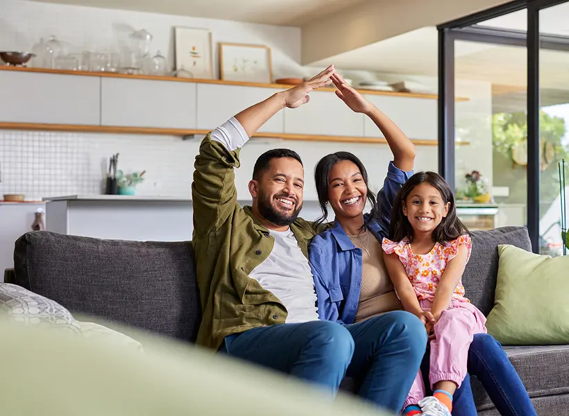 Happy family sitting on the couch