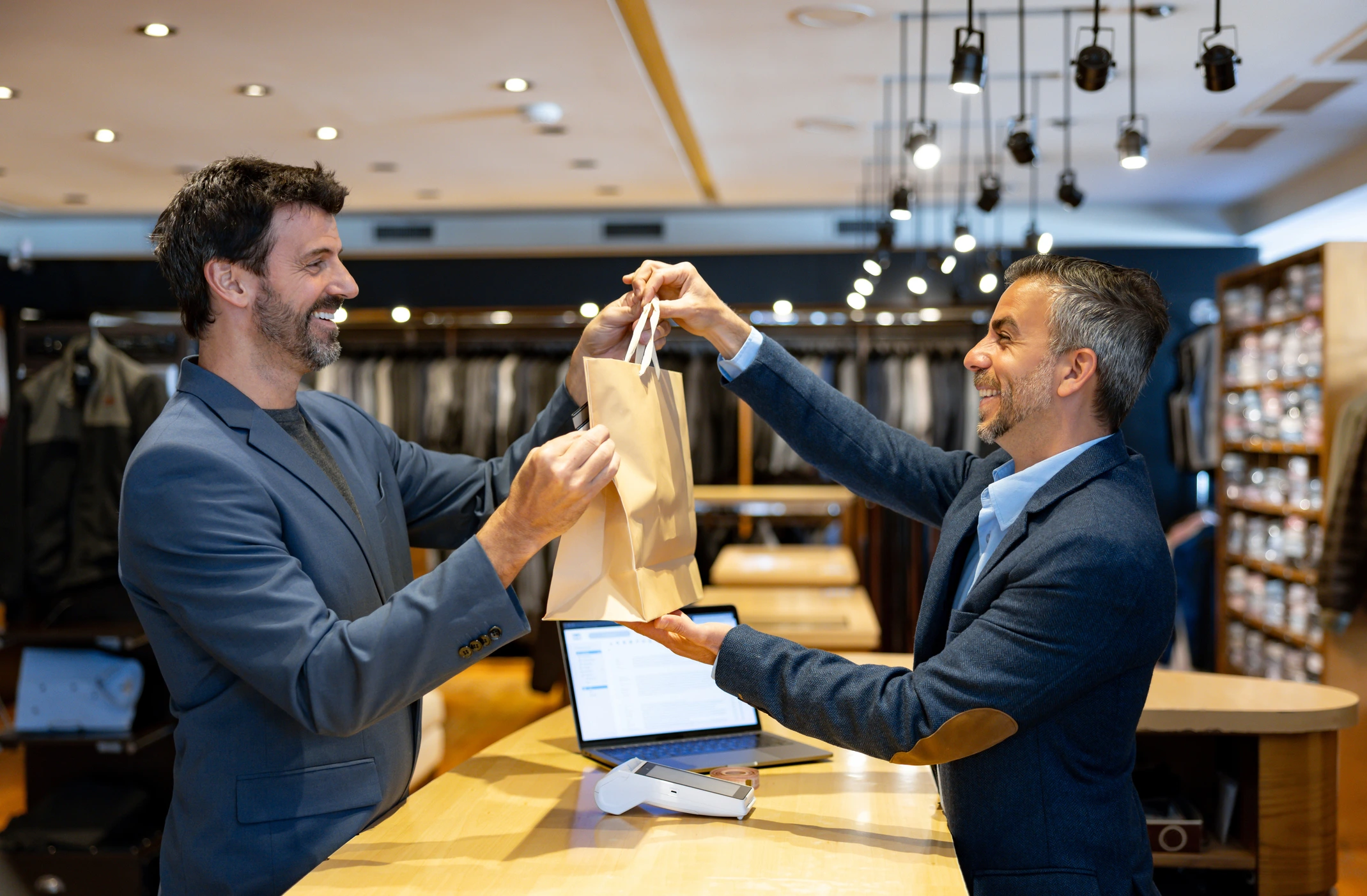 Happy customer at clothing store checkout